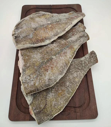 Фото Камбала белобрюхая желтоперая потрошеная без головы 200-(штучной заморозки)